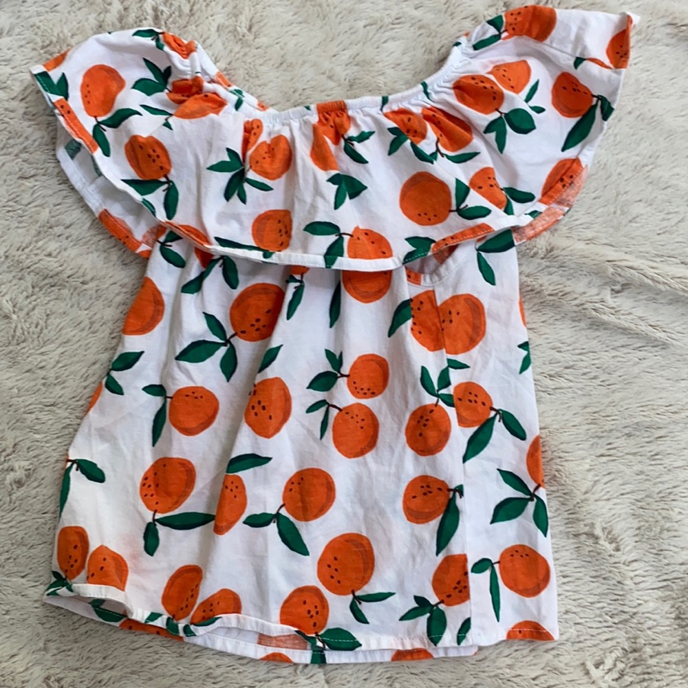 Off the shoulder shirt with oranges